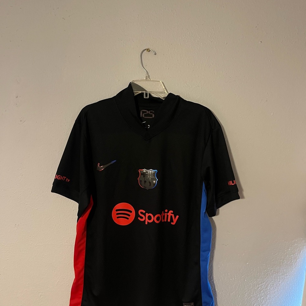 Nike Black Soccer Jersey with Red and Blue Stripes